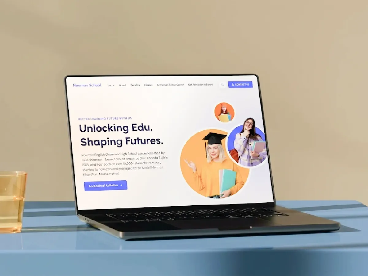 The Nouman School home page on a laptop